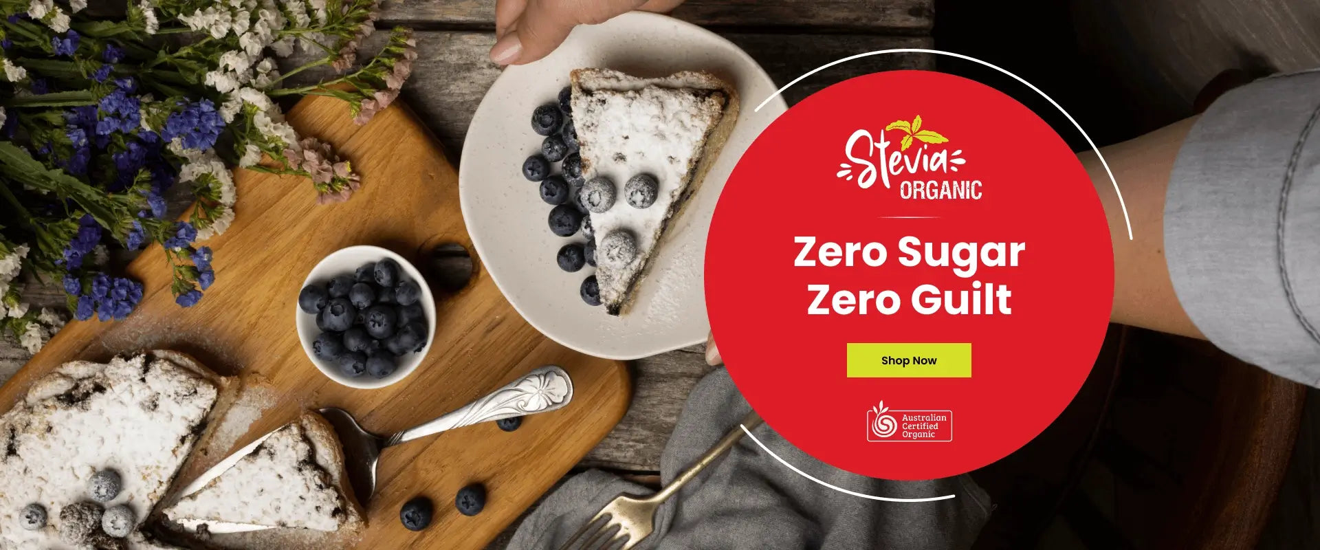 Stevia Organic product with a plate of dessert and blueberries on a wooden board.