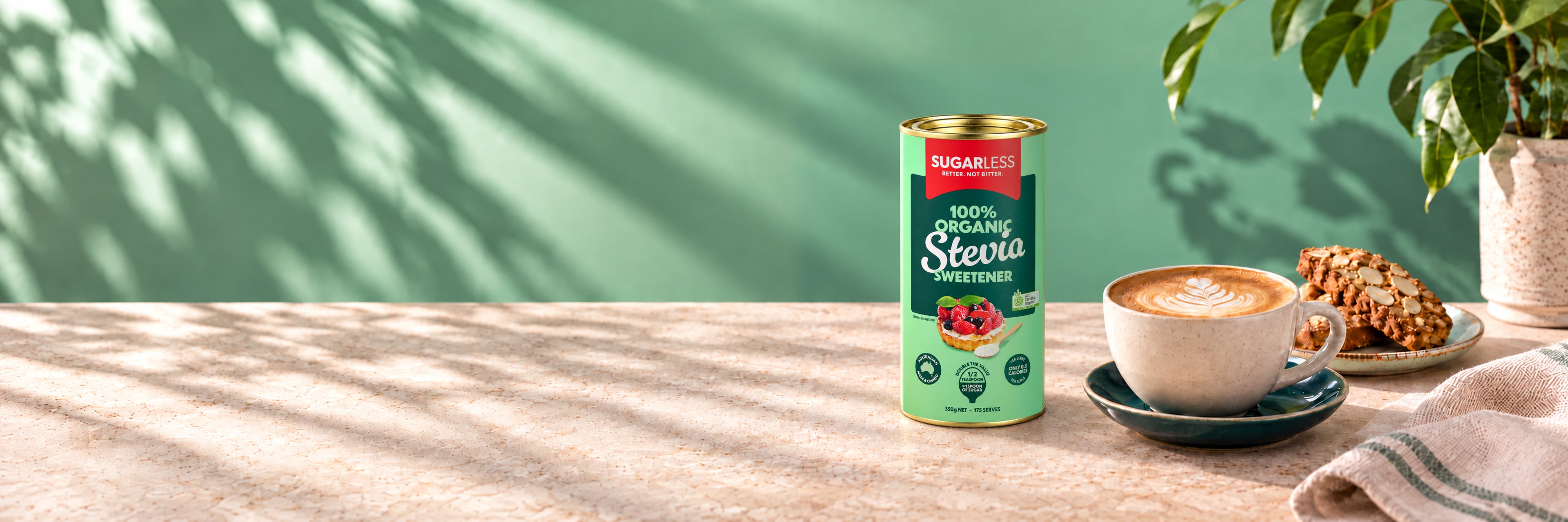 Sugarless Organic Stevia 350g standing on a sunlit stone bench beside coffee and almond biscuits